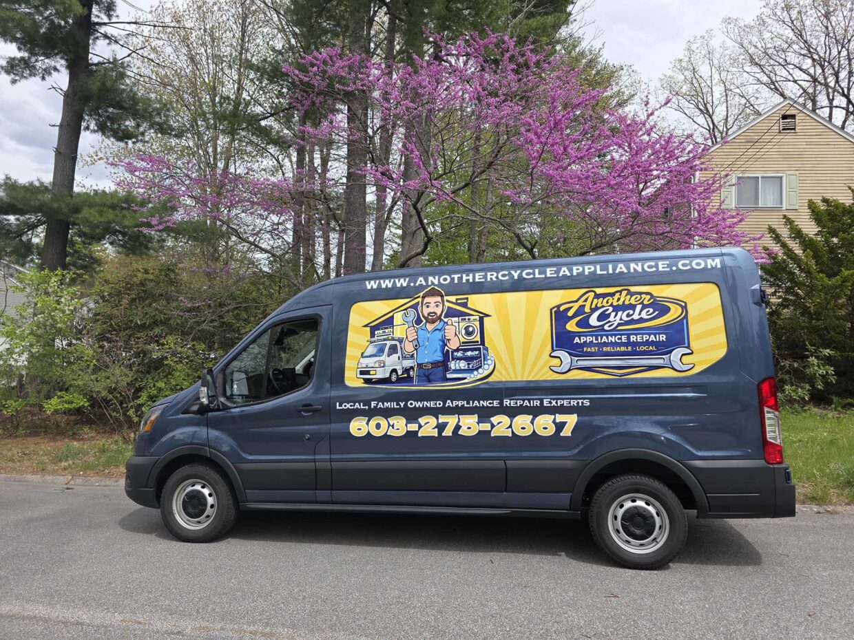 Another Cycle service van parked on a residential street with flowering spring trees