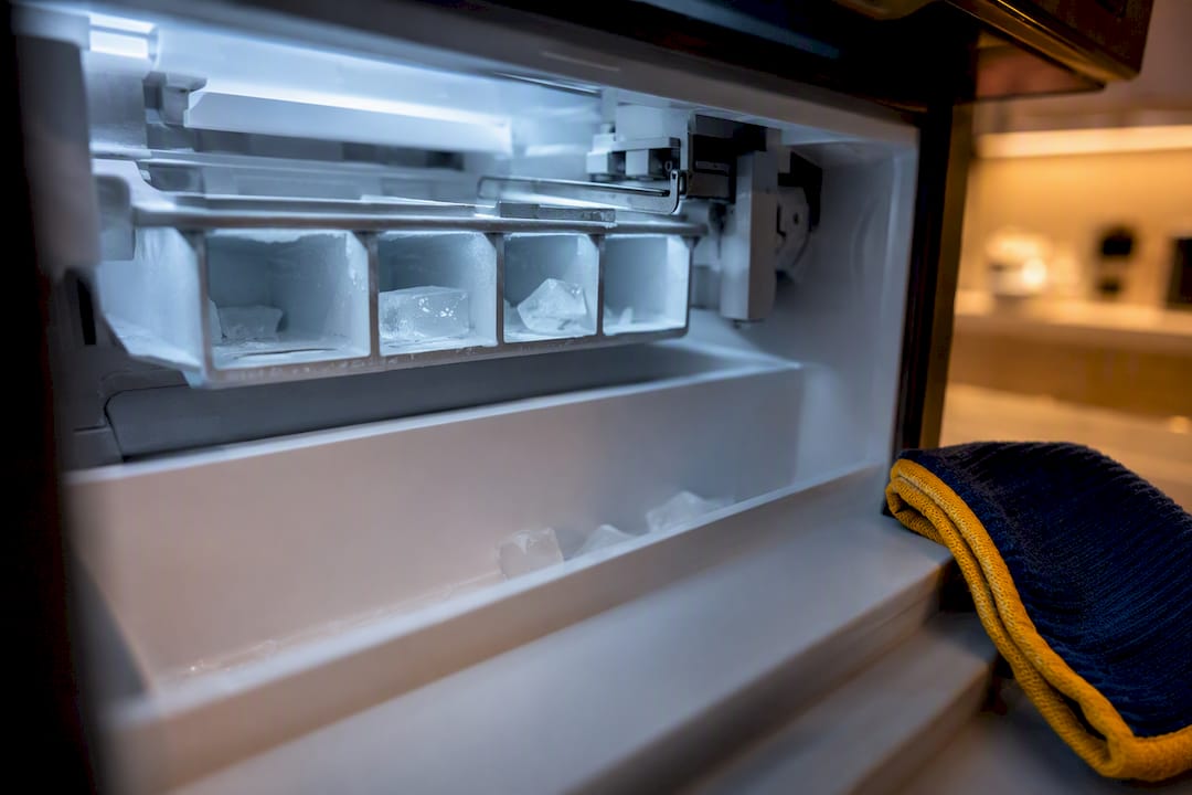 Sparse ice cubes inside freezer ice maker