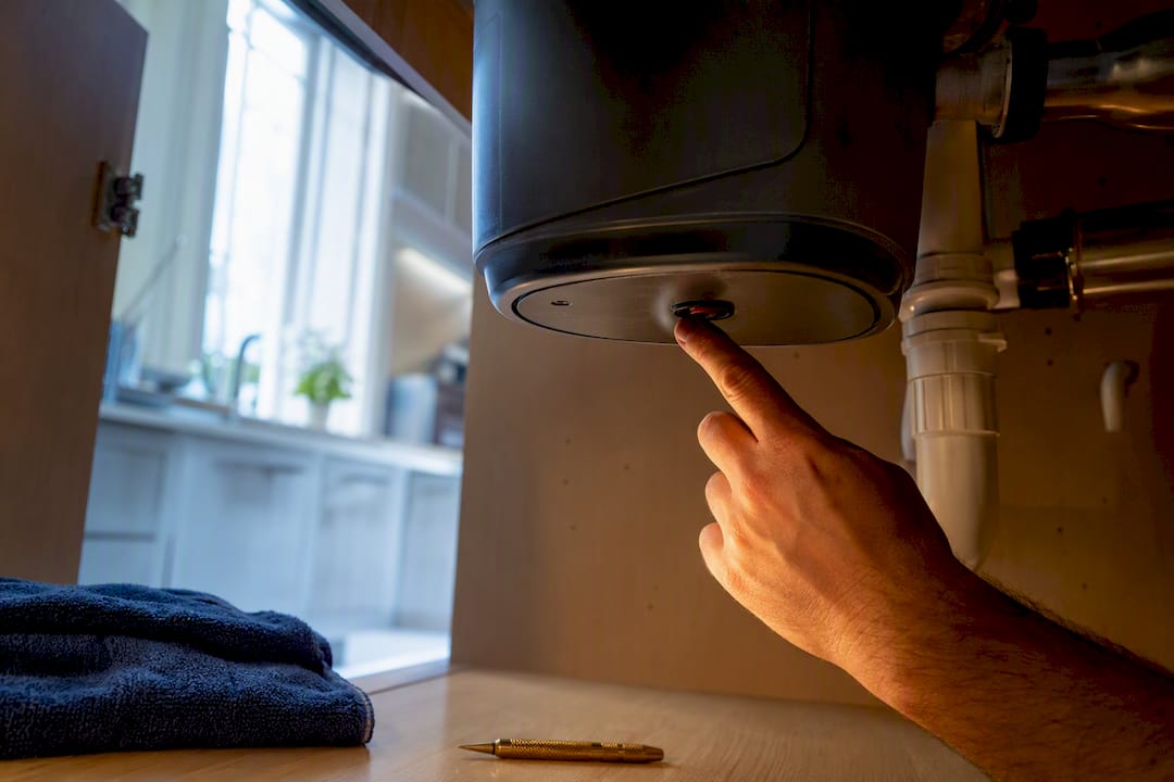 Hand Pressing Disposal Reset Button